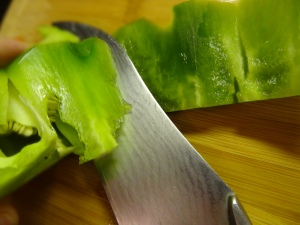 Then with the knife proceed to cut the pepper's rib so that you can cut the inside core (where the seeds are)